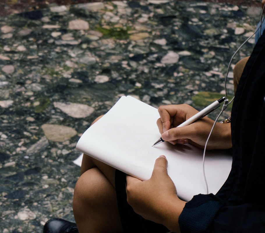 Image of woman journaling to create a ritual for how to journal article